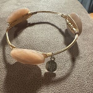 Bourbons and Bowties Bangle 
Gold and Pink Stone Bracelet